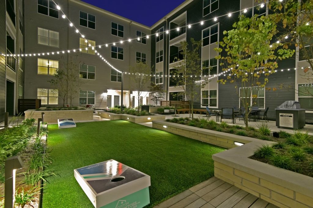 Watermark Exterior Gaming Area With Bollards String Lights And Accent Lights 11
